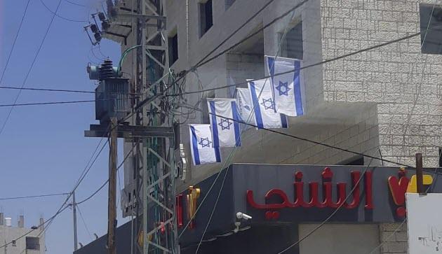 דגלי ישראל שתלו חיילים בכפר חווארה (באדיבות המצלם)